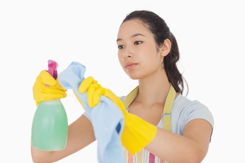 Cleaner preparing carpet cleaning equipment before a service visit